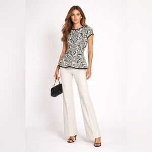 Valentina Shah black and white knit short sleeve peplum top. Estimated M.